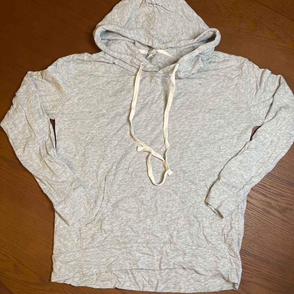 Light grey hoodie.